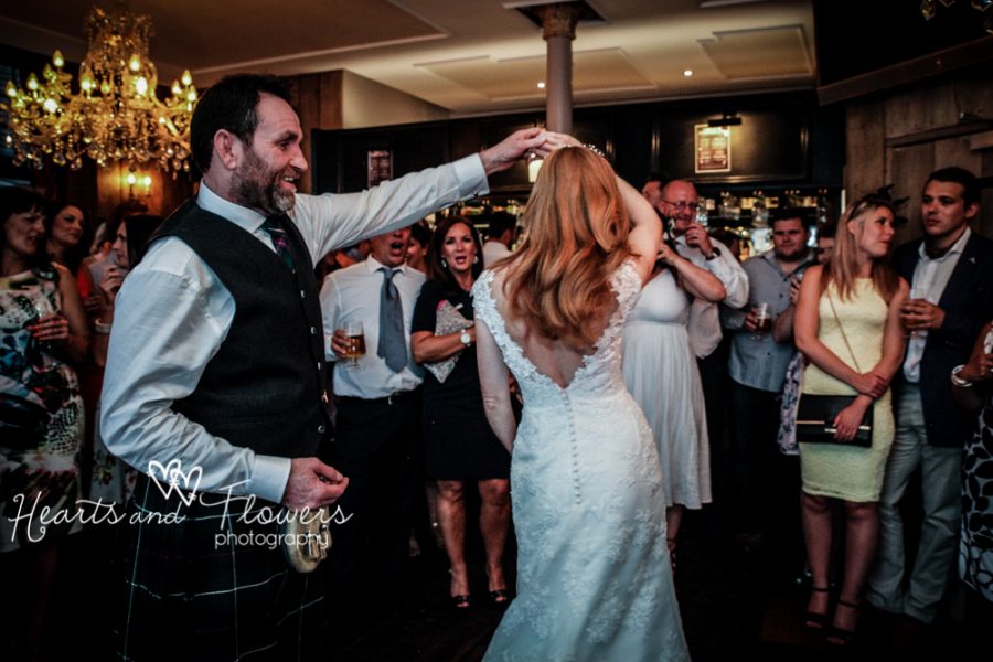 beautiful bride dances with her new husband